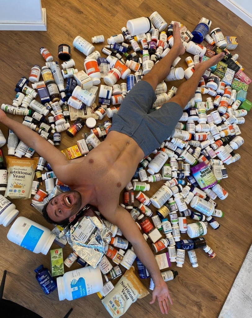 Joe Cohen, 36, of Brooklyn, in a sea of ​​daily nutritional supplements.