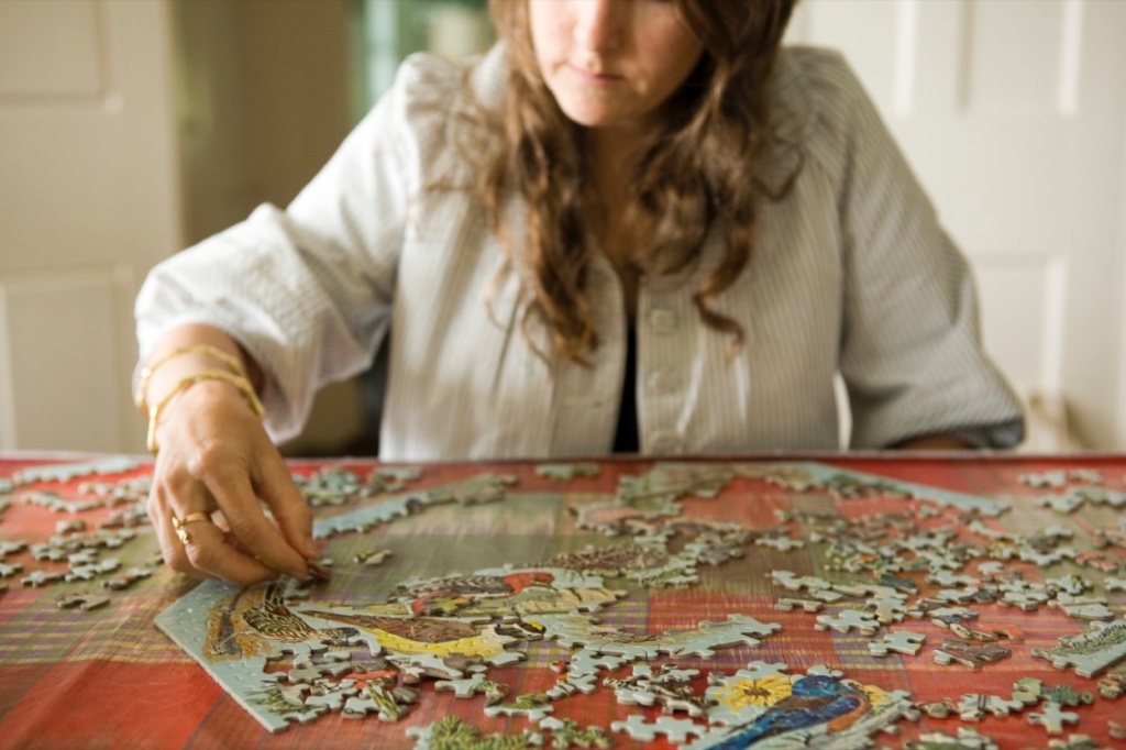 stoned night in: the person does the puzzle