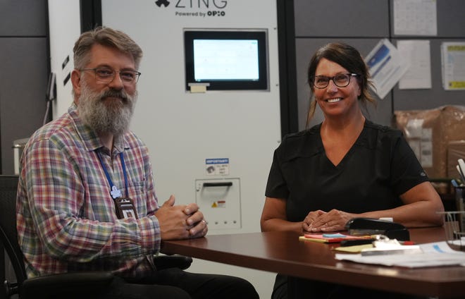 CompDrug CEO Dustin Mets and Director of Nursing Tawnya Tucker say they are pleased with the Opio-made Zing automated dosing machine, which has been used at CompDrug's North Side dispensary.